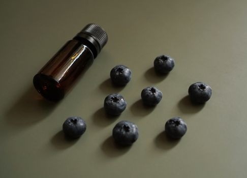 blueberries with a glass bottle