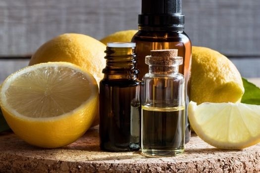  lemon with essential oil bottles