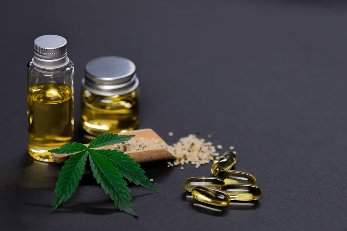 A picture showing terpenes, edibles, cannabis, and pills on a dark background