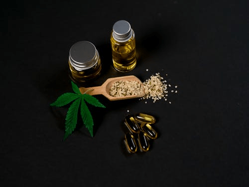 A picture showing terpenes, edibles, cannabis, and pills on a dark background
