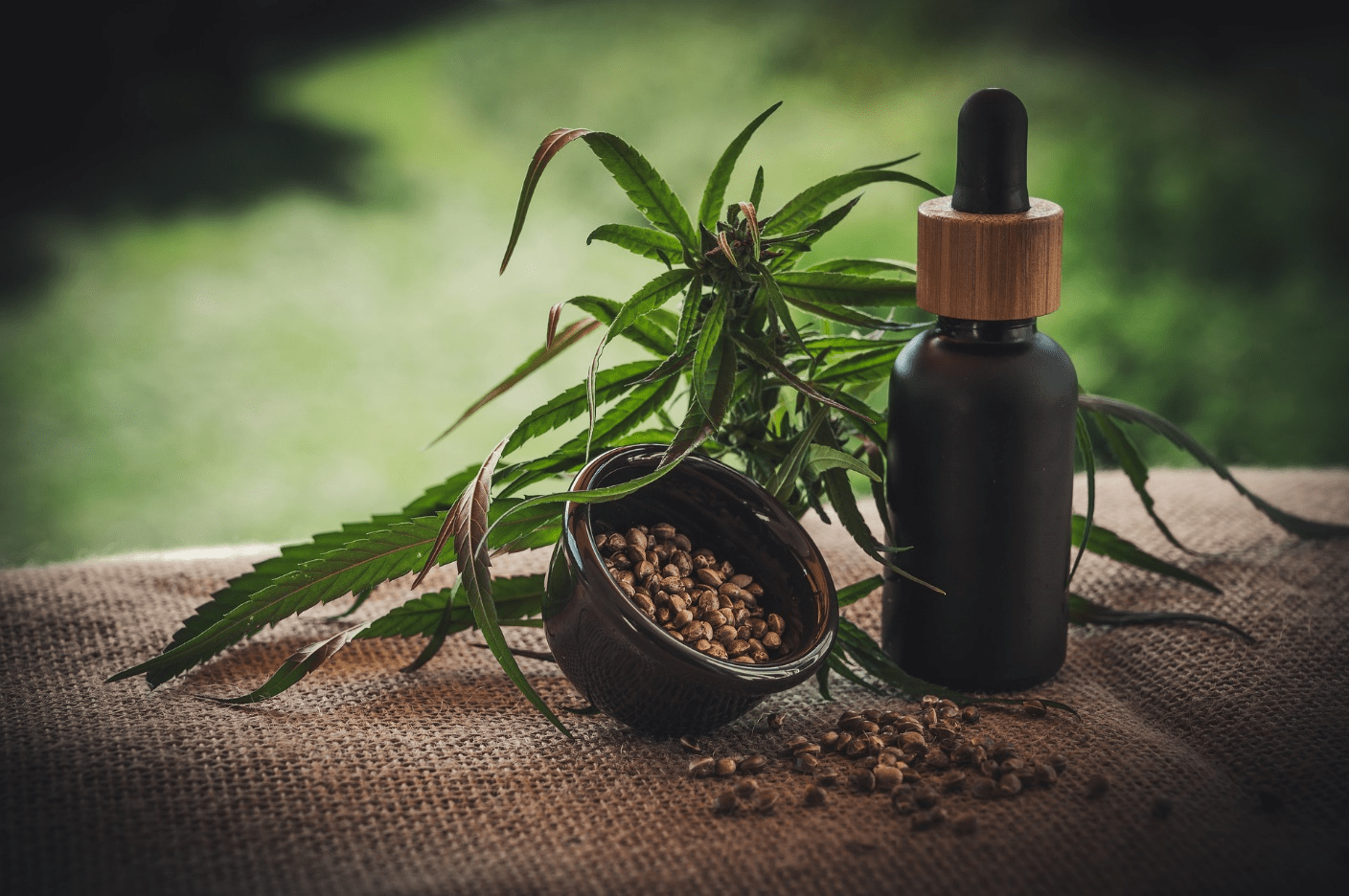 a bottle of essential oil and cannabis