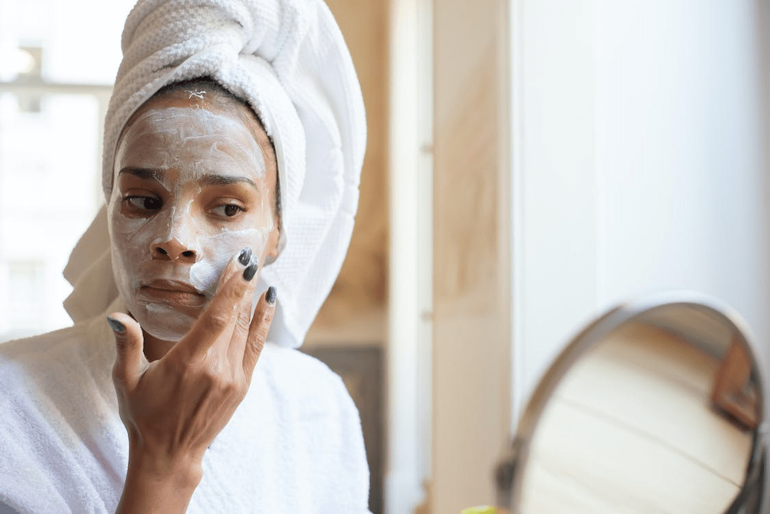 a Woman Applying Moisturizing Cream on her Face