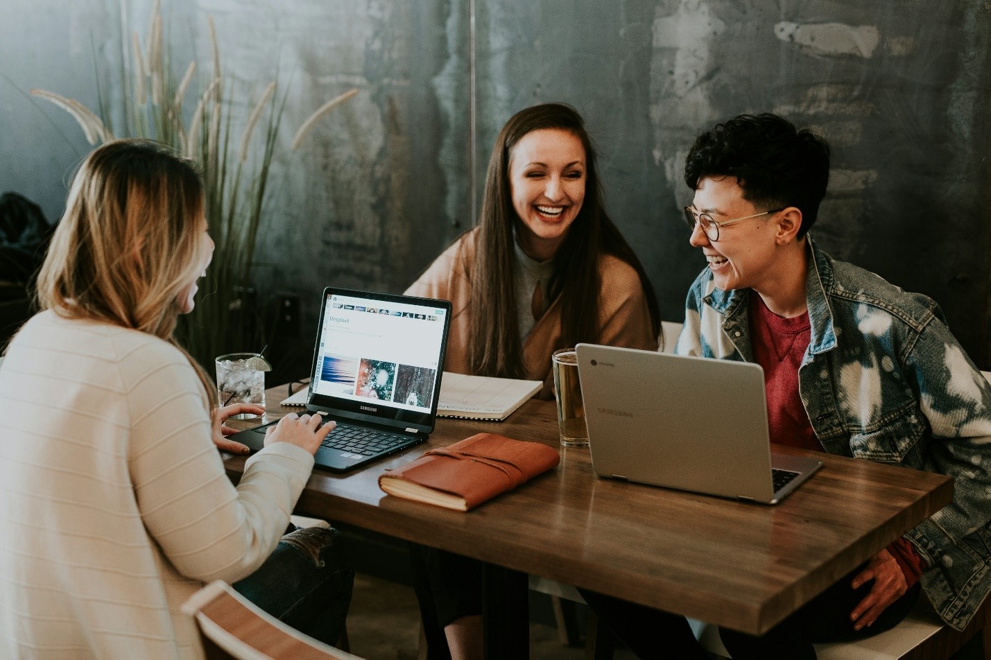 A group of people at work laughing