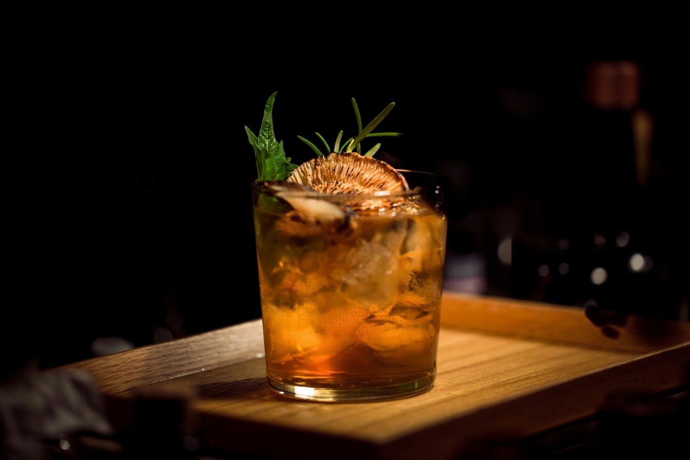 drink with ice and an orange slice 