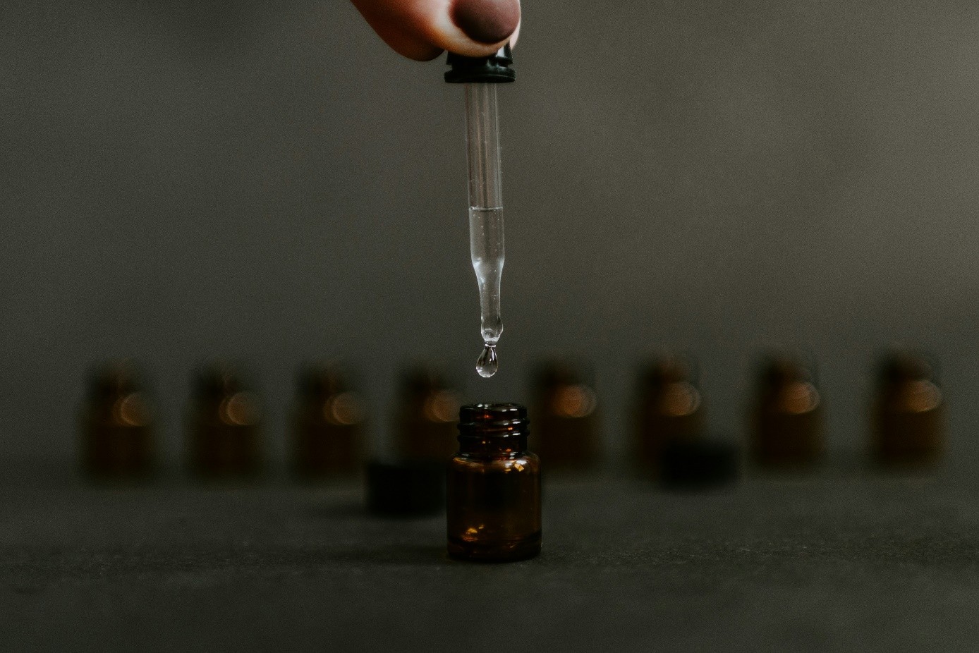 liquid dripping into the bottle 