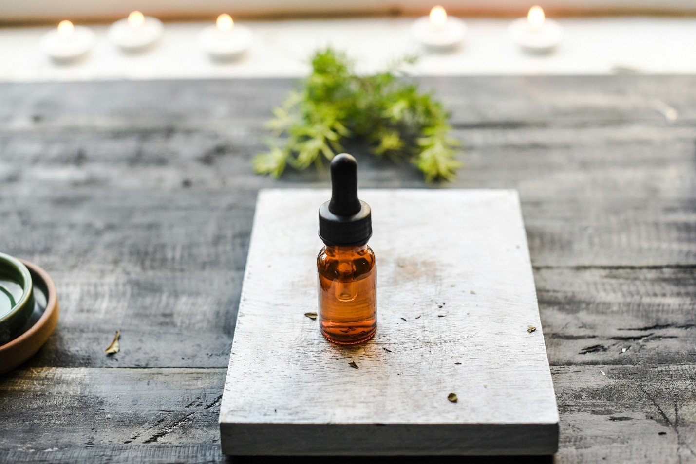 an amber bottle on a wooden table