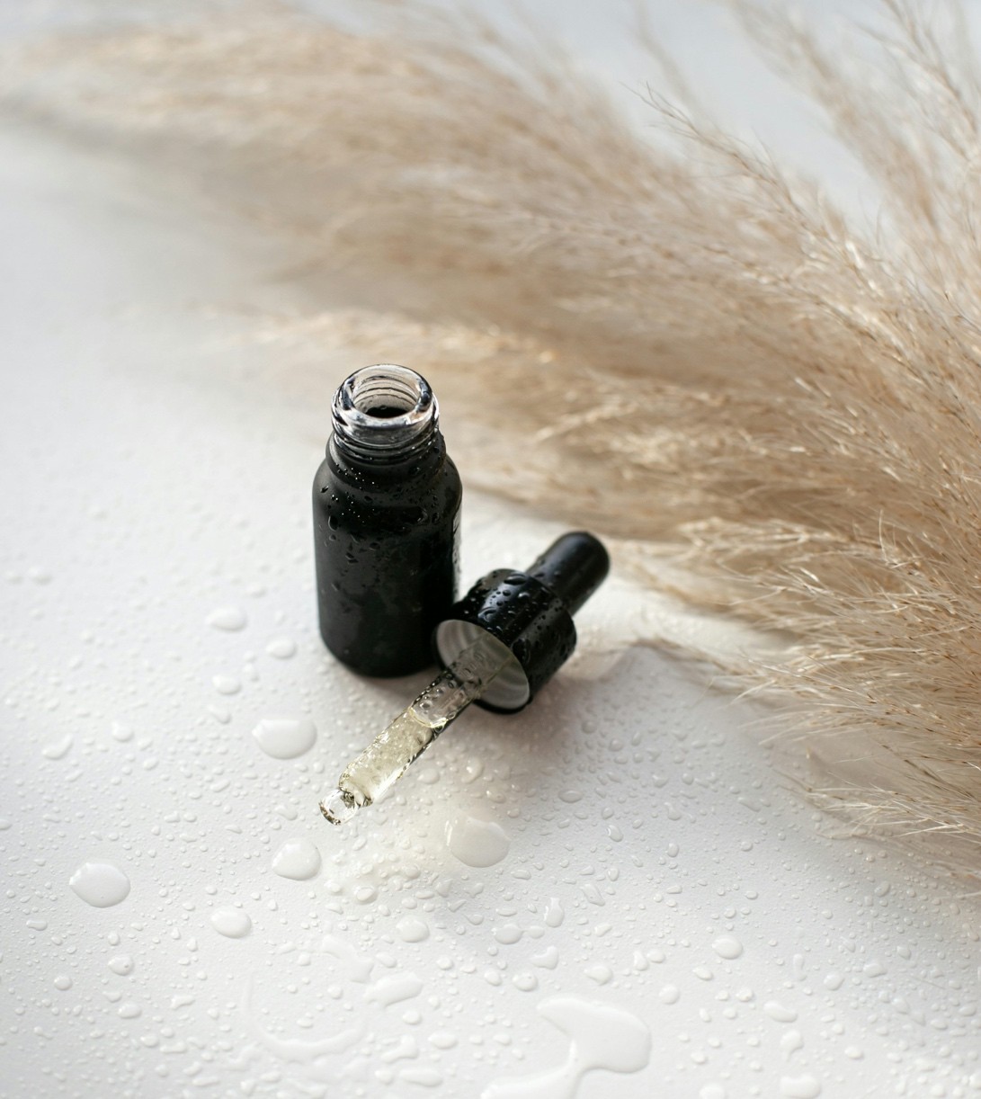 a small brown bottle with a dropper