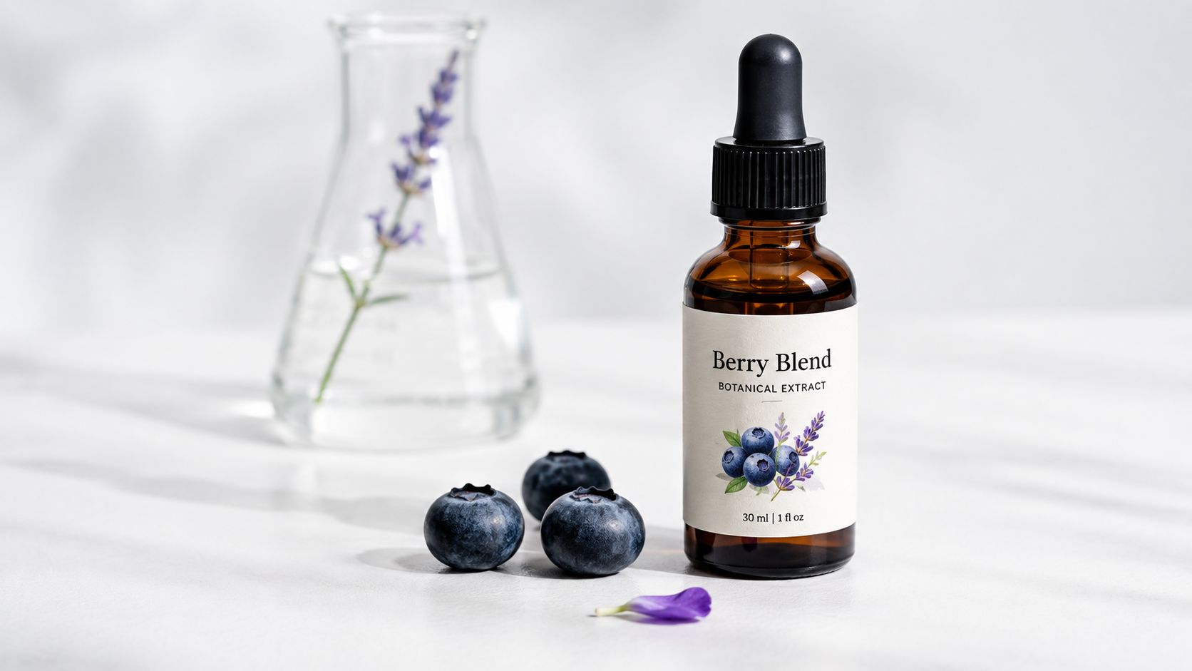 An amber dropper bottle labeled Berry Blend botanical extract sits beside fresh blueberries and a lavender sprig.