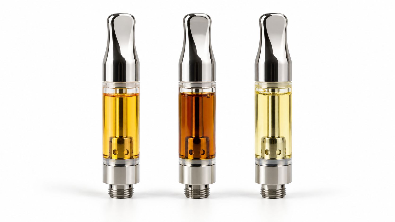Three vape cartridges with different shades of cannabis oil standing upright on a clean white background.